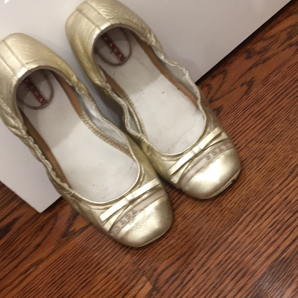 Gold metallic Prada flats